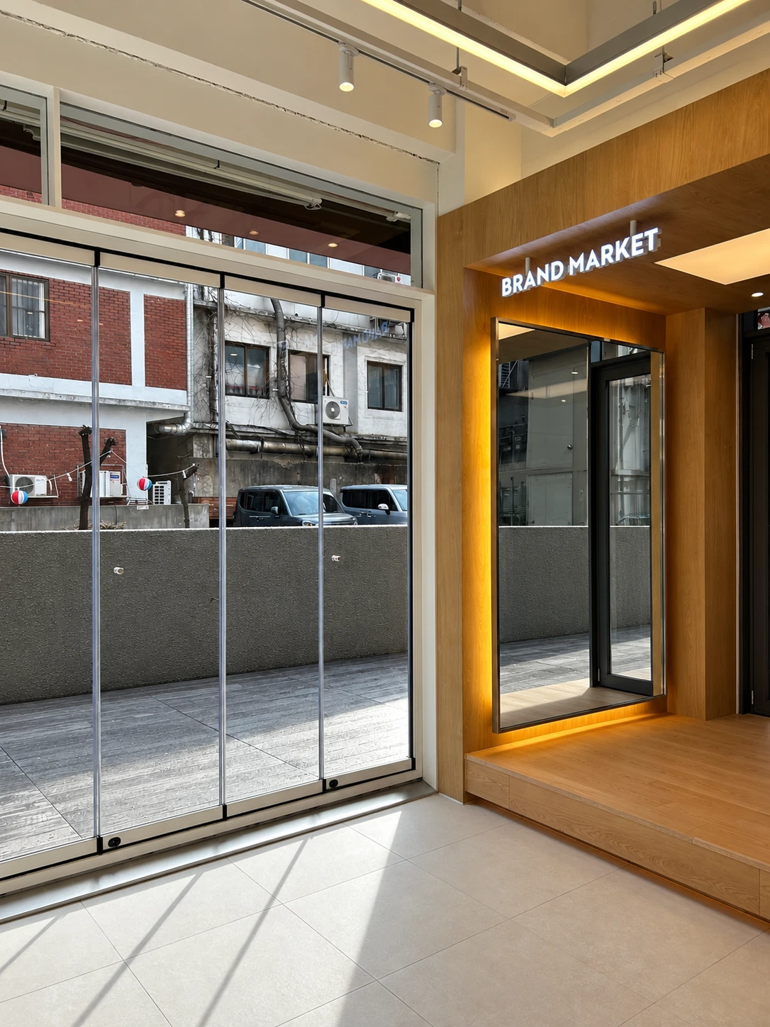 Timber display portal, mirror and illuminated Brand Market lettering