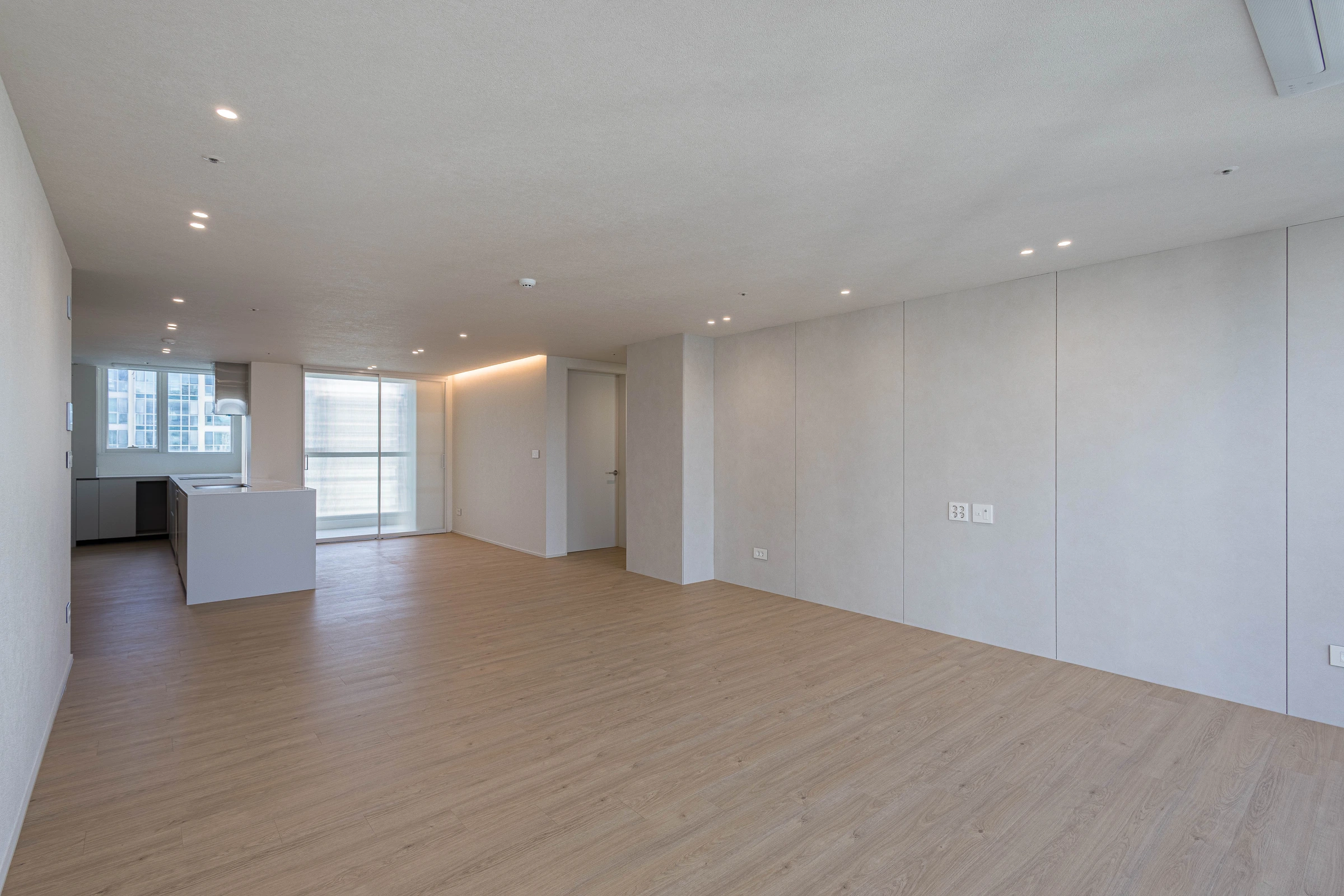 Completed living space and kitchen — original photograph