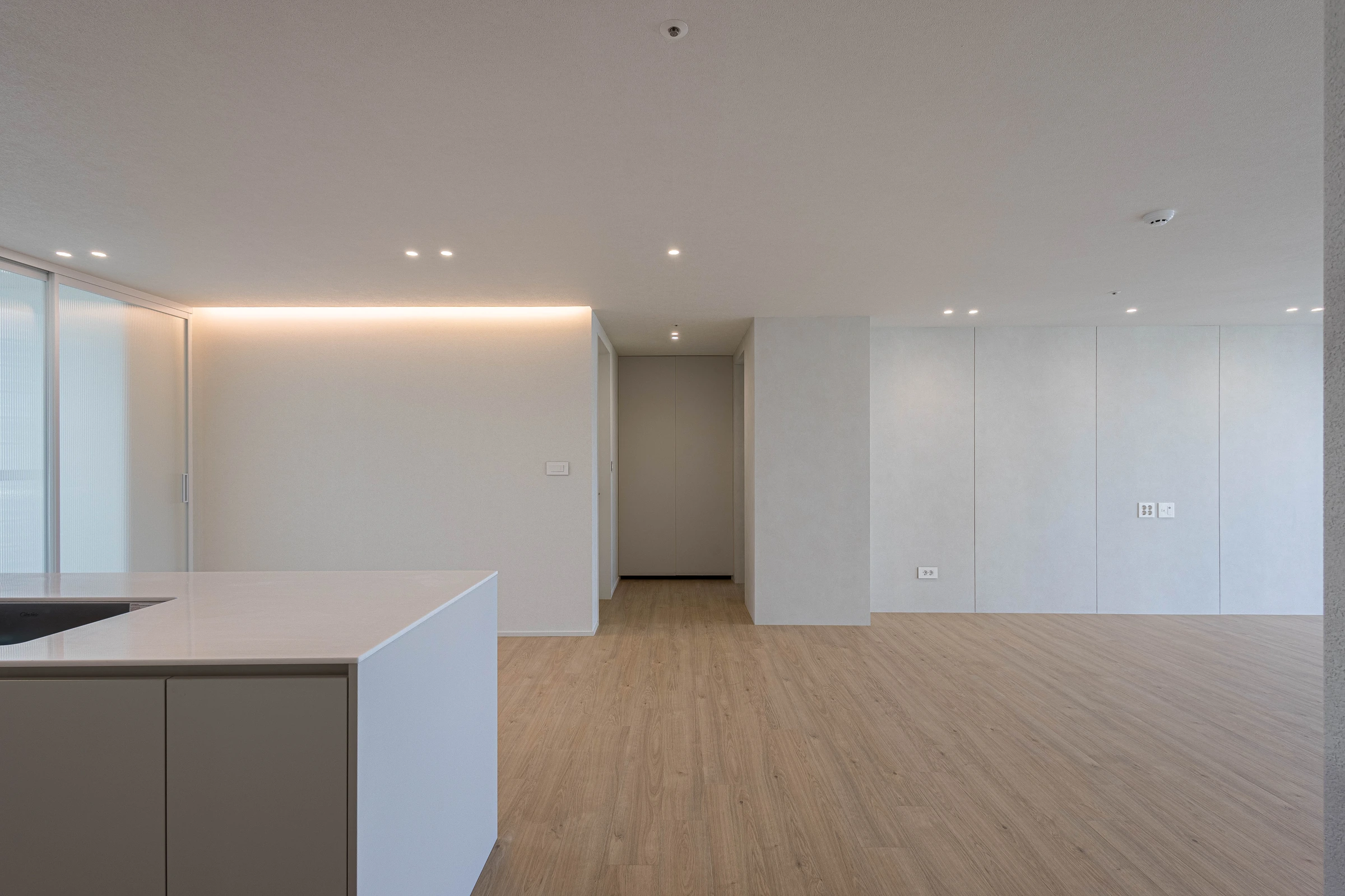 Completed living space viewed from kitchen — original photograph