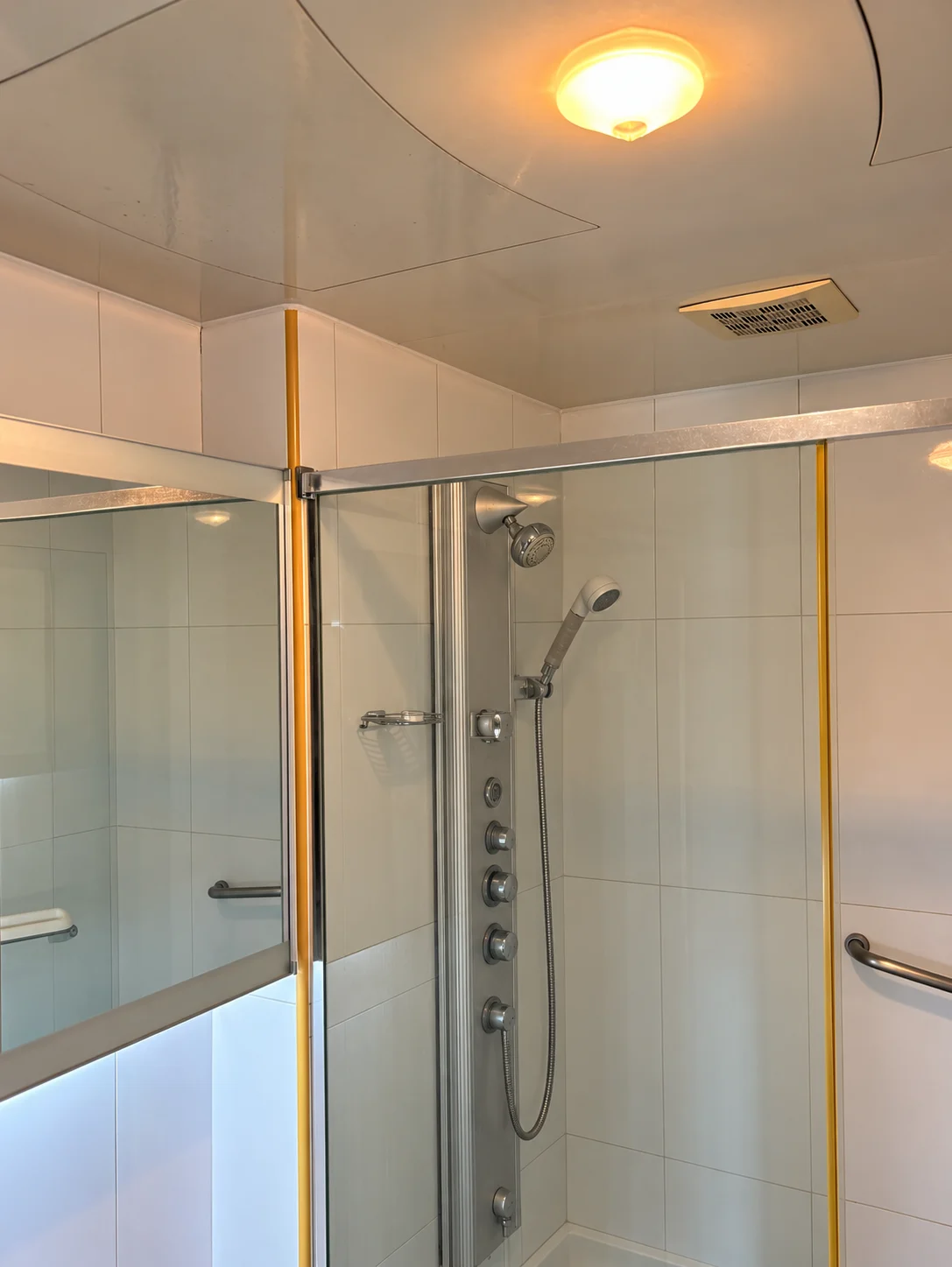 Original shower enclosure; people, annotations and loose items digitally removed; no toilet visible