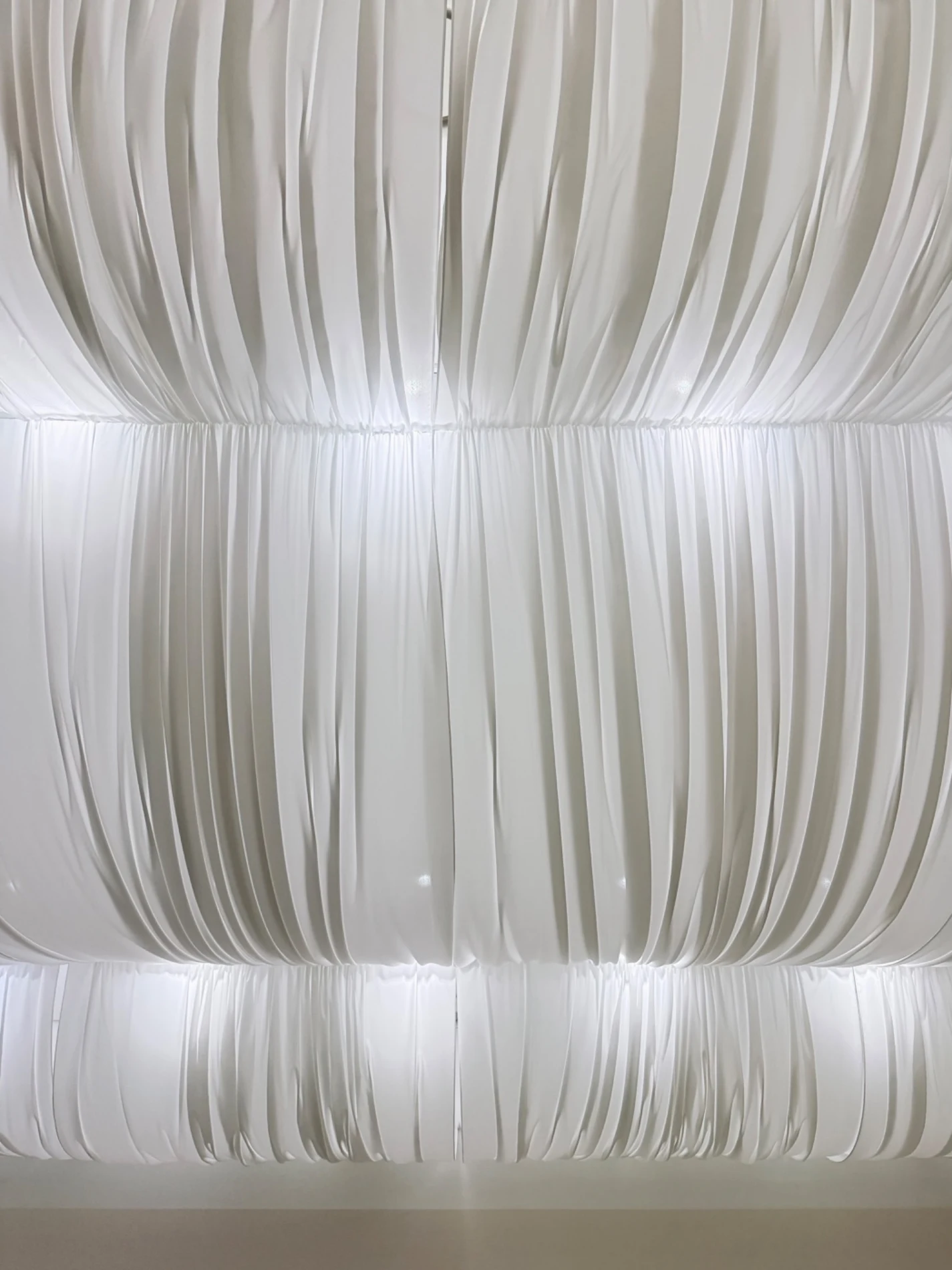 Fabric ceiling folds