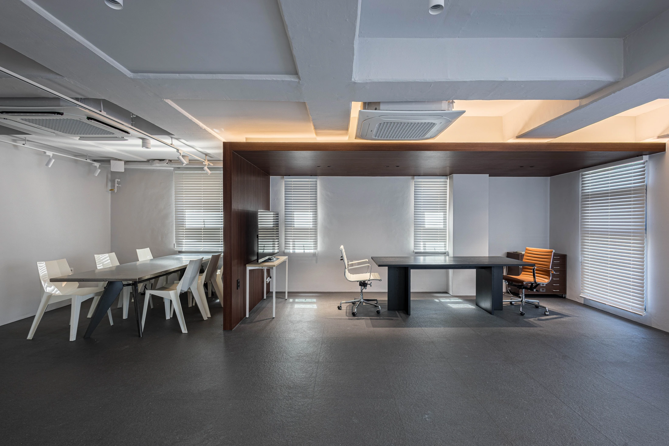 Timber ceiling and wall frame around the executive desk