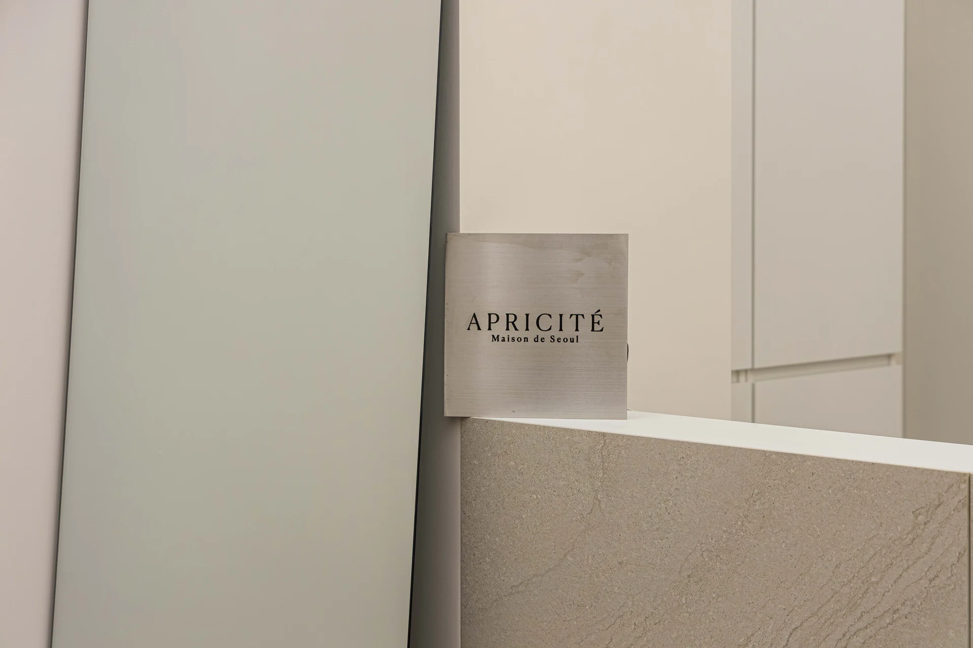Counter finish and metal brand sign