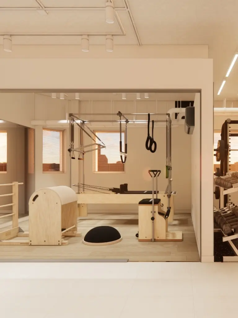 PT GUIDE — framed Pilates equipment and warm light