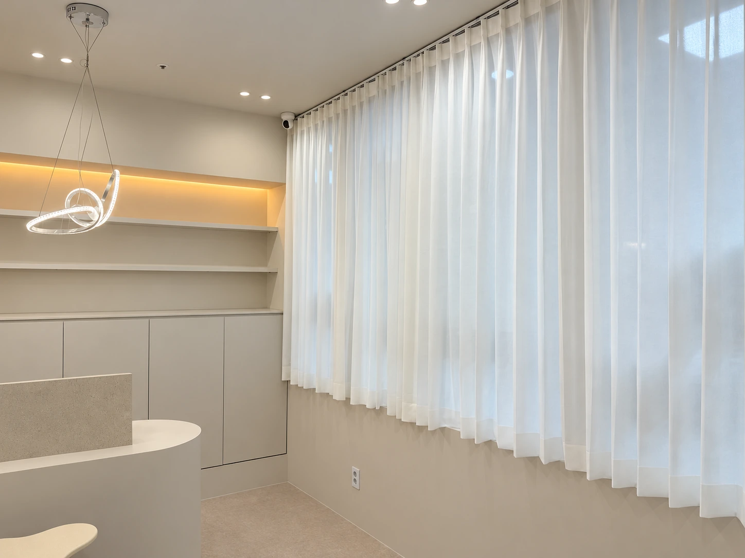 Reception counter and sheer curtains in natural light