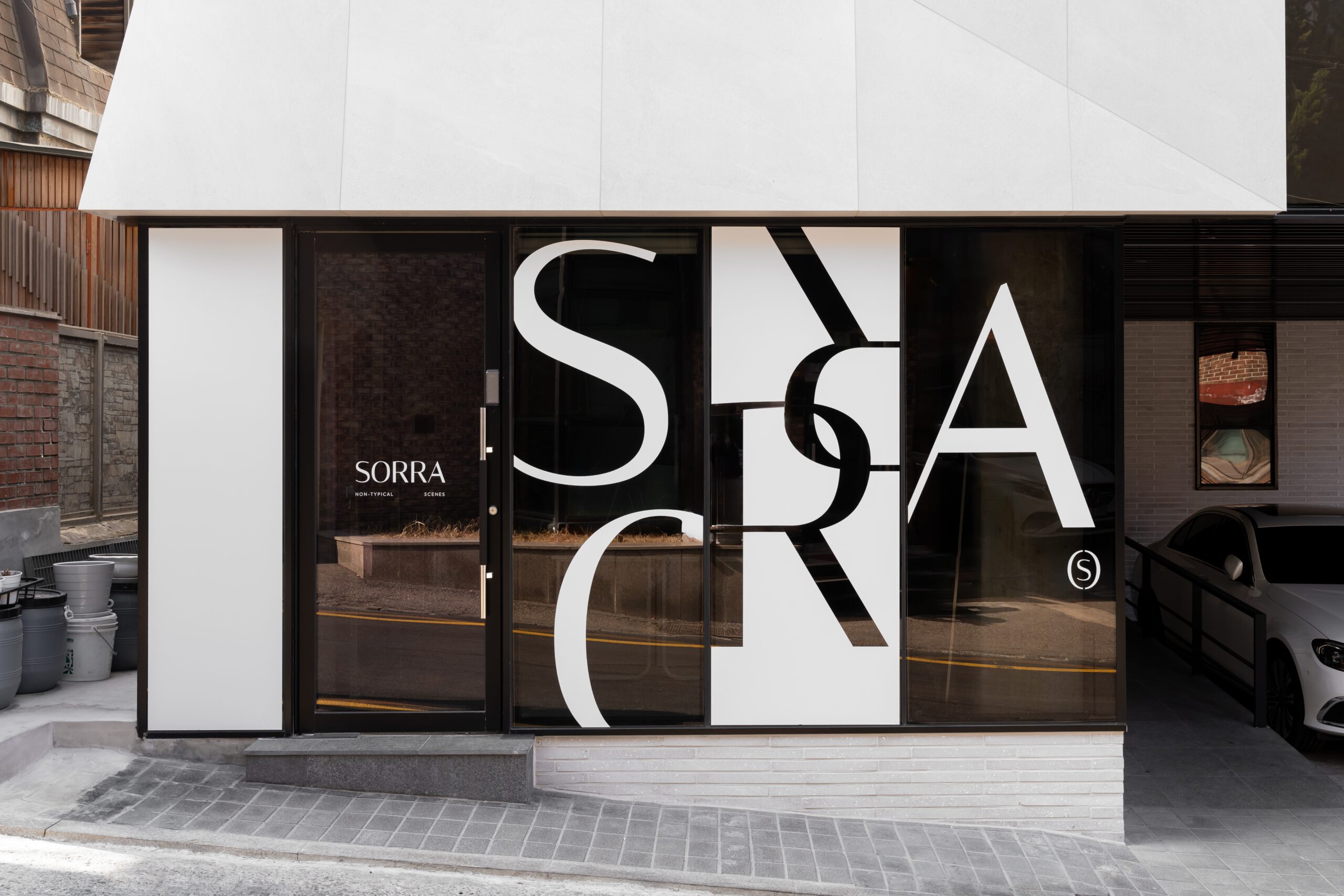 Street-level entrance and oversized window graphics