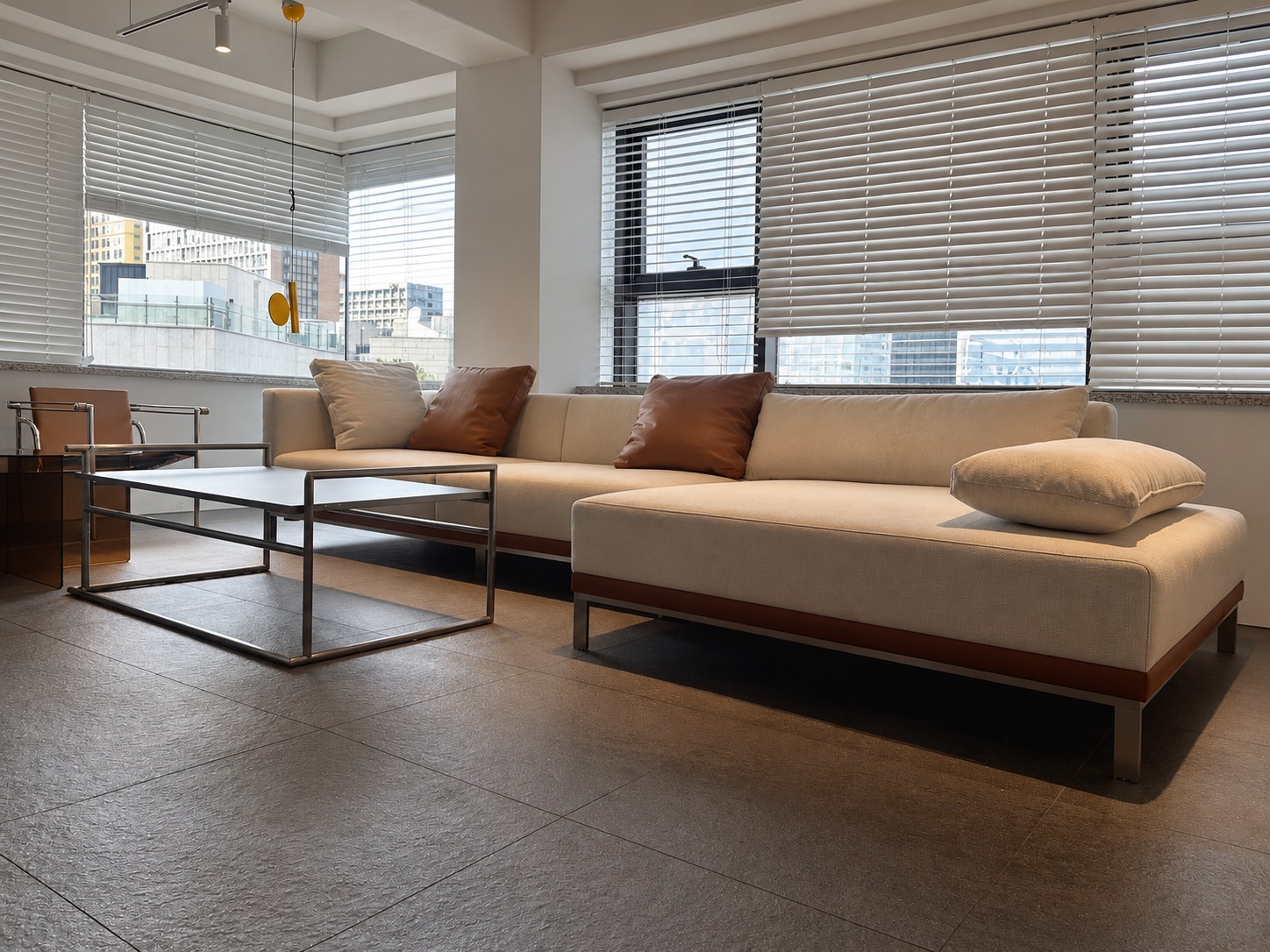 Window-side lounge with upholstered sofa and metal coffee table