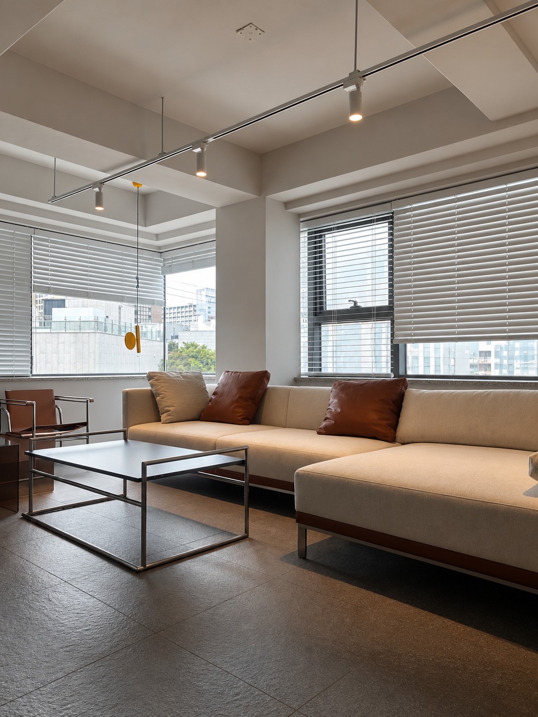 Sofa lounge, metal table and exposed ceiling